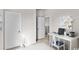 Bright bedroom with white walls, a desk and view into the ensuite bathroom at 432 Falling Leaf Loop, Myrtle Beach, SC 29588