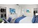 Spacious bedroom with a walk-in closet, and desk area featuring calming coastal artwork at 432 Falling Leaf Loop, Myrtle Beach, SC 29588