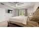 Large bedroom featuring plush carpet, neutral walls, and a decorative ceiling fan at 4609 Day Lily Run St., Myrtle Beach, SC 29579