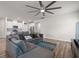 Comfortable living area with a large gray sectional sofa, wood flooring, and an open layout at 4609 Day Lily Run St., Myrtle Beach, SC 29579