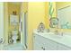 Bright bathroom featuring a single vanity, shower, and coastal decor at 48 Sw Wilmington St., Ocean Isle Beach, NC 28469