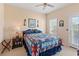 Comfortable bedroom featuring a queen-size bed, nautical decor, and ample natural light at 48 Sw Wilmington St., Ocean Isle Beach, NC 28469