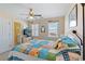 Comfortable bedroom featuring TV, adjacent bathroom, and nautical themed decor at 48 Sw Wilmington St., Ocean Isle Beach, NC 28469
