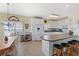 Well-lit kitchen featuring white cabinets, modern appliances, and breakfast bar seating at 48 Sw Wilmington St., Ocean Isle Beach, NC 28469