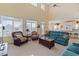 Spacious living area with multiple windows, comfortable seating, and open floor plan at 48 Sw Wilmington St., Ocean Isle Beach, NC 28469