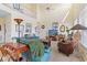 Bright living room featuring high ceilings, comfortable seating, and abundant natural light at 48 Sw Wilmington St., Ocean Isle Beach, NC 28469