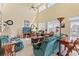 Bright living room with vaulted ceilings, large windows, and comfortable seating at 48 Sw Wilmington St., Ocean Isle Beach, NC 28469