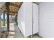 Convenient outdoor shower and seating area underneath the raised beach house at 48 Sw Wilmington St., Ocean Isle Beach, NC 28469