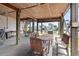 Inviting outdoor space with a dining area and hanging hammocks, perfect for enjoying waterfront views at 48 Sw Wilmington St., Ocean Isle Beach, NC 28469