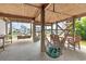 Relaxing outdoor space featuring hanging hammocks and a dining table underneath the raised beach house at 48 Sw Wilmington St., Ocean Isle Beach, NC 28469