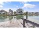 Picturesque waterfront view from the dock overlooking neighboring homes and canal at 48 Sw Wilmington St., Ocean Isle Beach, NC 28469