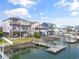 Waterfront homes with private boat docks and decks along the waterway at 48 Sw Wilmington St., Ocean Isle Beach, NC 28469