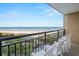 Enjoy ocean views from this balcony, complete with seating and an ocean breeze at 4800 S Ocean Blvd. # 420, North Myrtle Beach, SC 29582