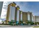 Stunning exterior view of an ocean front resort featuring multiple floors and private balconies at 4800 S Ocean Blvd. # 420, North Myrtle Beach, SC 29582