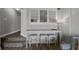 Living area with table seating and staircase to another level at 4800 S Ocean Blvd. # 420, North Myrtle Beach, SC 29582