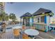 Charming outdoor dining area with tables and chairs, perfect for enjoying meals with an ocean view at 4800 S Ocean Blvd. # 420, North Myrtle Beach, SC 29582