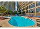 Inviting outdoor pool with sundeck and comfortable lounge chairs, set against the backdrop of the resort at 4800 S Ocean Blvd. # 420, North Myrtle Beach, SC 29582