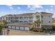 Coastal-style condo complex featuring multiple stories, private balconies and a convenient ground-level garage at 4860 Carnation Circle # 302, Myrtle Beach, SC 29577