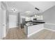 Well-appointed kitchen featuring white cabinets, stainless steel appliances, granite countertops, and breakfast bar at 4860 Carnation Circle # 302, Myrtle Beach, SC 29577