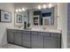 Bathroom featuring double vanity, stylish framed mirrors, modern fixtures and hardware, and gray cabinets at 531 Oak Landing Dr., Myrtle Beach, SC 29588