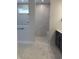 Modern bathroom featuring a walk-in shower with marble tile, a built-in bench, and sleek black hardware at 531 Oak Landing Dr., Myrtle Beach, SC 29588