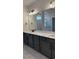 Bathroom features double sink vanity with gray cabinetry, quartz countertops, and a large mirror at 531 Oak Landing Dr., Myrtle Beach, SC 29588