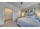 Bright bedroom featuring plush carpeting, stylish wall decor and a convenient walk-in closet at 531 Oak Landing Dr., Myrtle Beach, SC 29588