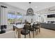 Open dining area with contemporary lighting fixtures and views to outdoor living space at 531 Oak Landing Dr., Myrtle Beach, SC 29588