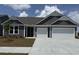 Charming single-Gathering home featuring a two-car garage, beautiful siding, and a well-manicured lawn at 531 Oak Landing Dr., Myrtle Beach, SC 29588