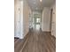 Elegant hallway with wood floors, decorative molding, and recessed lighting leading to living spaces at 531 Oak Landing Dr., Myrtle Beach, SC 29588