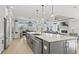 Open concept kitchen featuring a large island, stainless steel appliances, and backyard views at 531 Oak Landing Dr., Myrtle Beach, SC 29588