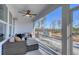 Cozy screened-in back porch with ceiling fan, outdoor kitchen, and wooded views at 531 Oak Landing Dr., Myrtle Beach, SC 29588