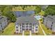 Aerial view of a beautiful condominium complex overlooking a lake, golf course, and swimming pool at 545 White River Dr. # 15 D, Myrtle Beach, SC 29579