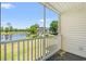 Screened porch with golf course and water views, ideal for relaxing and enjoying scenery at 545 White River Dr. # 15 D, Myrtle Beach, SC 29579