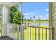 Screened porch with golf course and pond views, creating a serene outdoor retreat at 545 White River Dr. # 15 D, Myrtle Beach, SC 29579