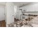 Bright kitchen with white cabinets, black countertops, and modern appliances at 545 White River Dr. # 15 D, Myrtle Beach, SC 29579