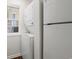 Laundry room with stackable washer and dryer, and a window for natural light at 545 White River Dr. # 15 D, Myrtle Beach, SC 29579