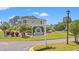 Entrance to River Oaks Golf & Tennis Resort showcasing lush landscaping and well-maintained buildings at 545 White River Dr. # 15 D, Myrtle Beach, SC 29579