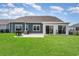 Spacious backyard with a patio, grill, and fenced yard at 567 Hickman St., Surfside Beach, SC 29575
