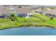 Expansive fenced backyard with a patio overlooking a tranquil pond at 567 Hickman St., Surfside Beach, SC 29575