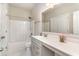 Clean and functional bathroom with ample lighting, shower and tub, and storage space at 567 Hickman St., Surfside Beach, SC 29575