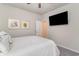 Bedroom features a modern TV and provides convenient access to another room at 567 Hickman St., Surfside Beach, SC 29575