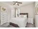 Cozy bedroom with soft natural light features carpet and a window dressed with elegant sheer curtains at 567 Hickman St., Surfside Beach, SC 29575