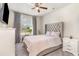 Comfortable bedroom featuring a cozy bed, carpet, and a bright window with a view of the outdoors at 567 Hickman St., Surfside Beach, SC 29575