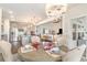 Inviting dining room connects to the kitchen and living room, featuring hardwood floors and stylish chandelier at 567 Hickman St., Surfside Beach, SC 29575