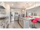Modern kitchen featuring stainless steel appliances, granite countertops, and hardwood floors with open layout at 567 Hickman St., Surfside Beach, SC 29575