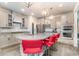 Stylish kitchen island with granite countertops, pendant lighting, and seating, perfect for entertaining guests at 567 Hickman St., Surfside Beach, SC 29575
