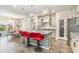 Modern kitchen island with granite countertops, pendant lighting, and sleek bar stools, adjacent to the dining area at 567 Hickman St., Surfside Beach, SC 29575
