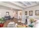 Cozy living room featuring hardwood floors, coffered ceilings, and comfortable seating arrangements at 567 Hickman St., Surfside Beach, SC 29575