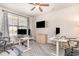 Bright home office featuring modern desks, ergonomic chairs, and a large window at 567 Hickman St., Surfside Beach, SC 29575